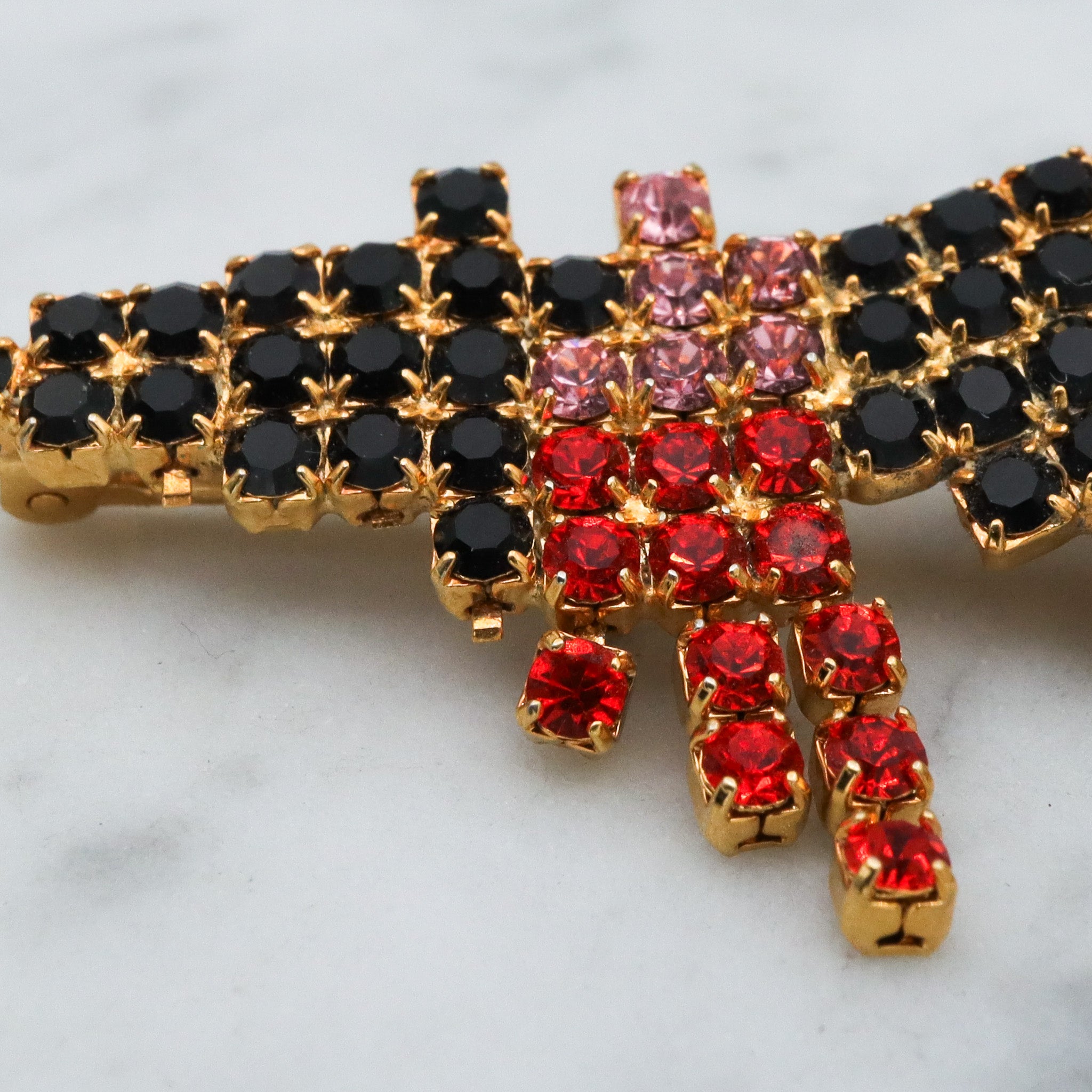 Vintage gold tone rhinestone witch brooch